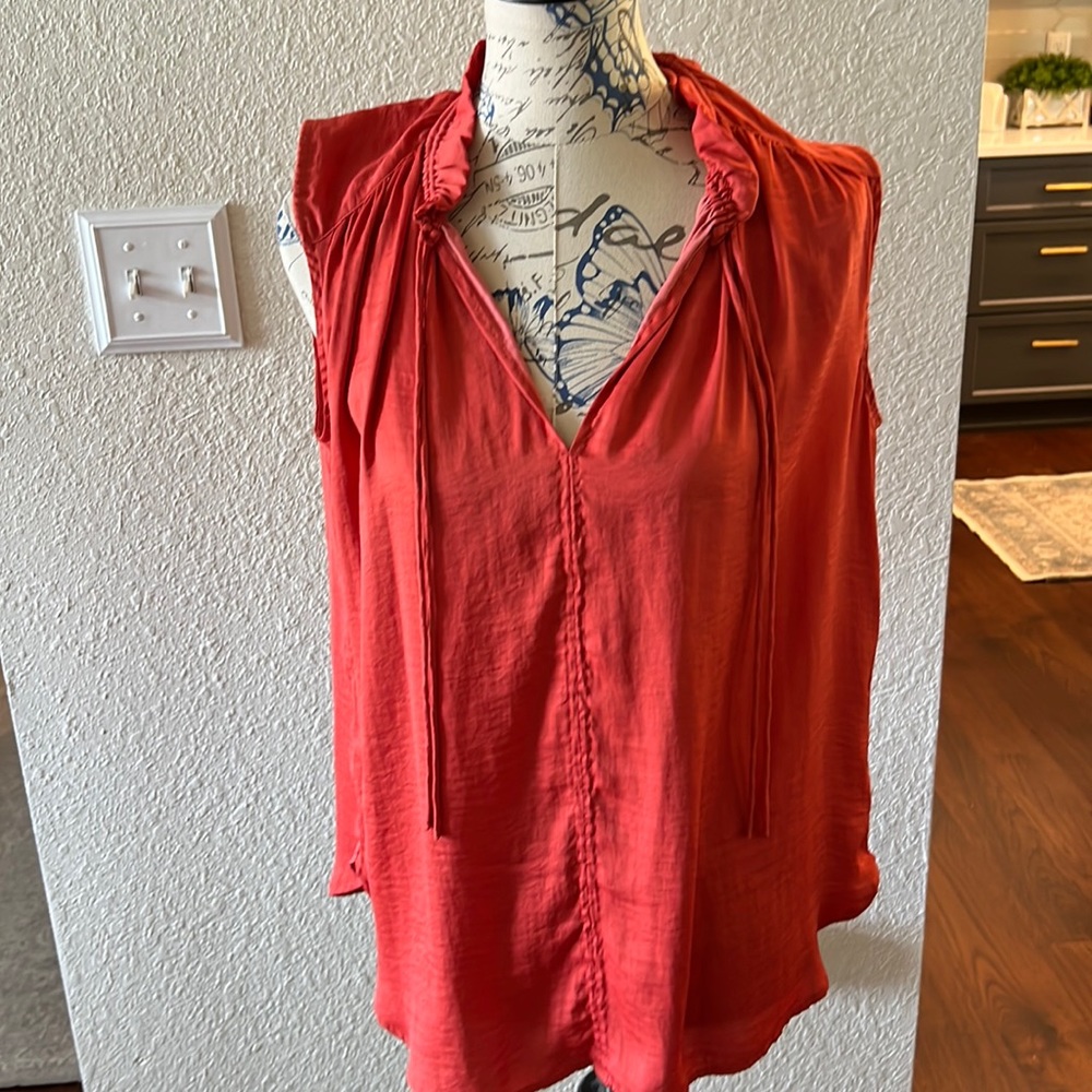 Orange sleeveless top from the Loft .